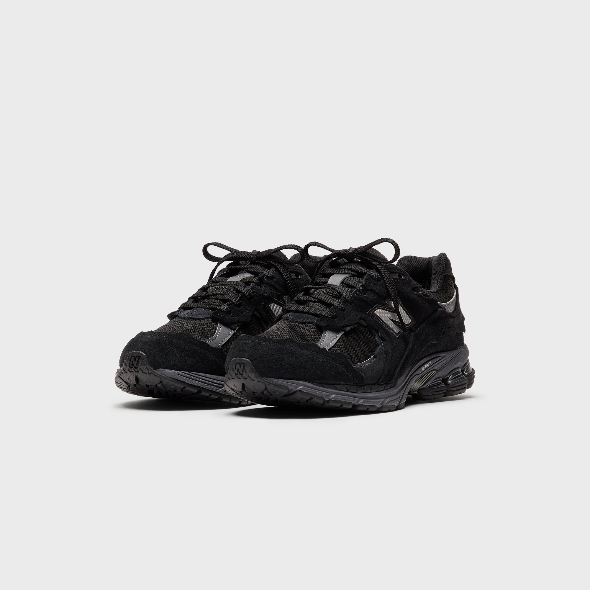 New Balance U2002DX - Black / Magnet
