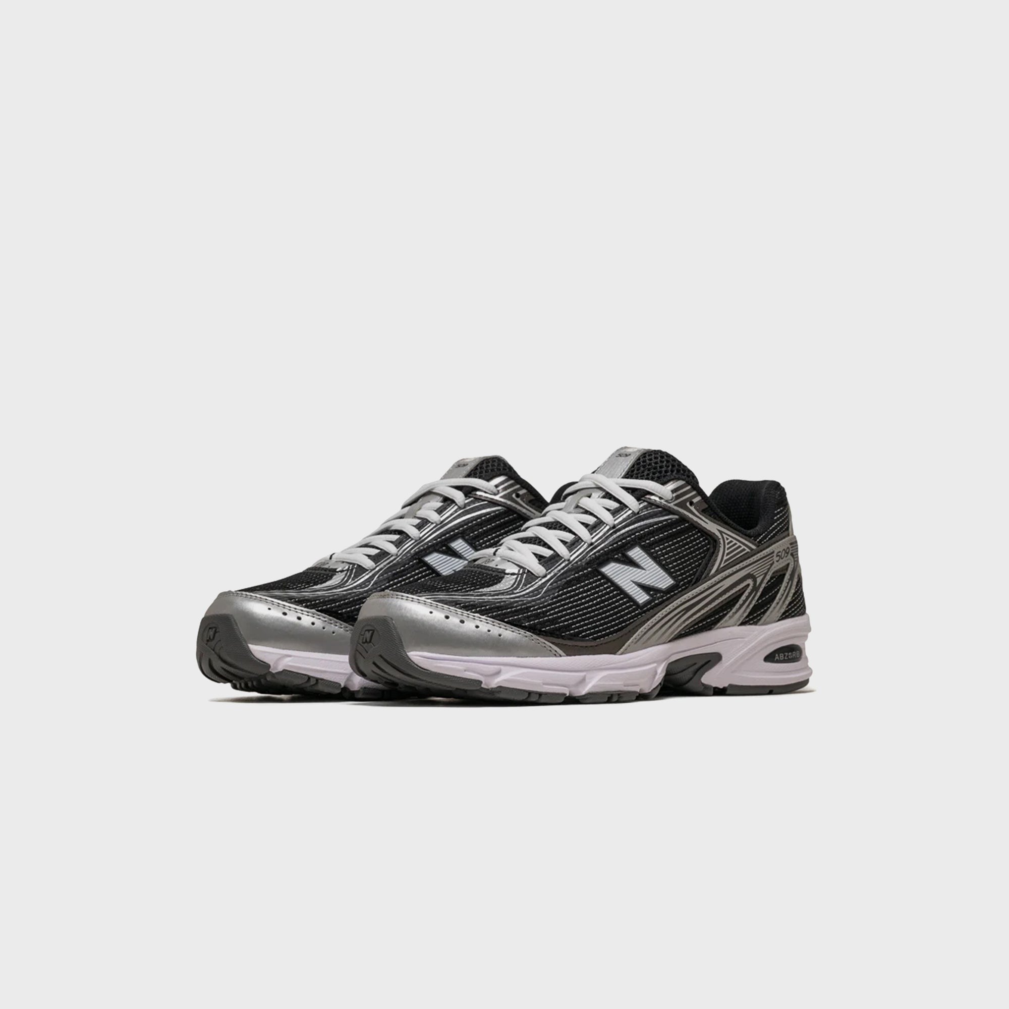 New Balance 509 - Black / White / Silver Metallic